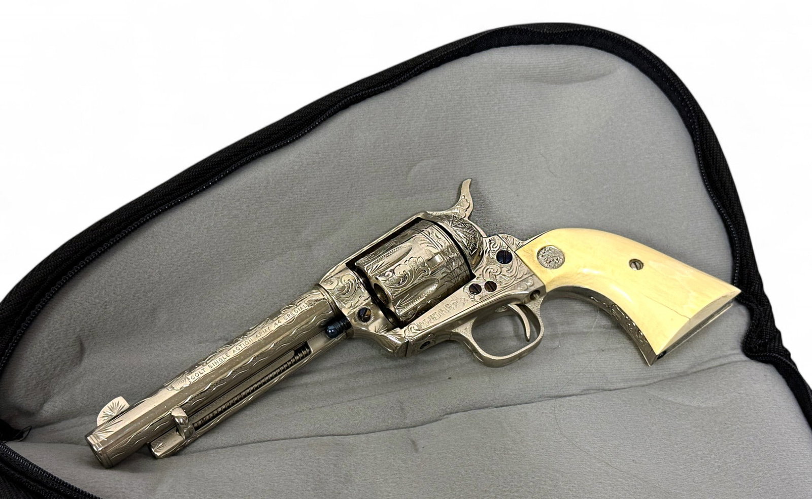 Excellent 1981 Engraved Colt 3rd Gen SAA Single Action Army .44 SPECIAL Nickel Revolver: S#: SA57989, Mfg. 1981 | 3rd Generation | Matching Cylinder | 5.5” Barrel | Absolute Stunning nearly fully engraved revolver with beautiful nickel finish, and fire blue screws. Silver medallion 