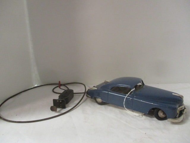 Vintage West Germany Arnold Cable Control Blue Sedan Tin Car: winds freely, does not steer or move-spring appears loose/broken inside controller