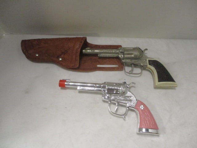 Old Hubley Pink Handle Toy Cap Gun and Black Handle Cap Gun in Holster: .
