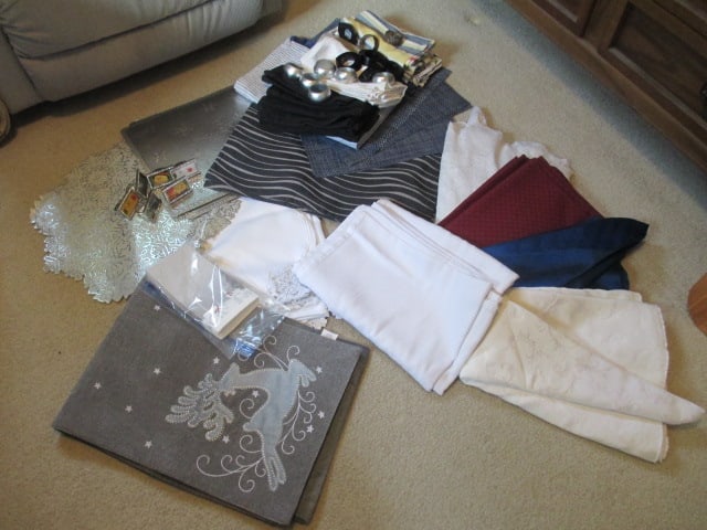 Grouping of Table Cloths, Napkins, Table Runners, Napkin Rings, Placemats and: Holiday Tableware. See pictures and preview for selection, Local Pickup Only