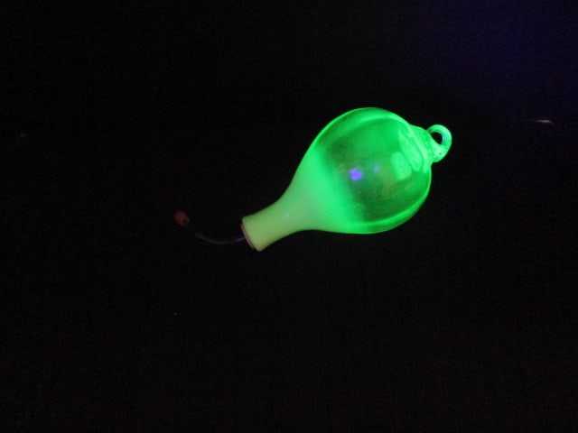 Gibson 2003 Light Green Uranium/Vaseline Glass Hummingbird Feeder: 8'' Tall x 4 1/2''.