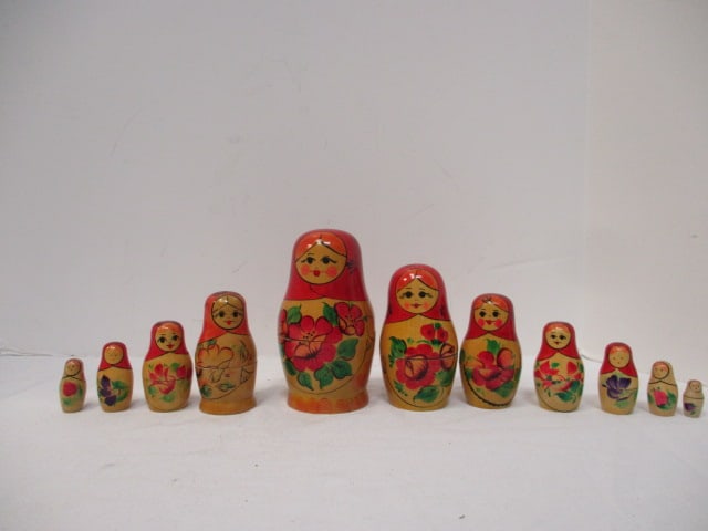 Two Russian Nesting Dolls: 4 Piece Doll Set 3 1/2"h, 7 Piece Doll Set 5 1/4"h
