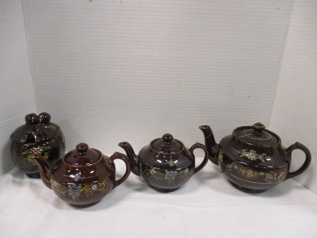 Japanese Brownware Teapots and Sugar Bowl: one teapot has repaired handle and largest teapot has repaired lid