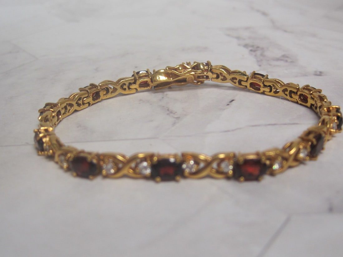 7" Gold over Sterling Silver Garnet and CZ Tennis Bracelet: Weighs 14 grams