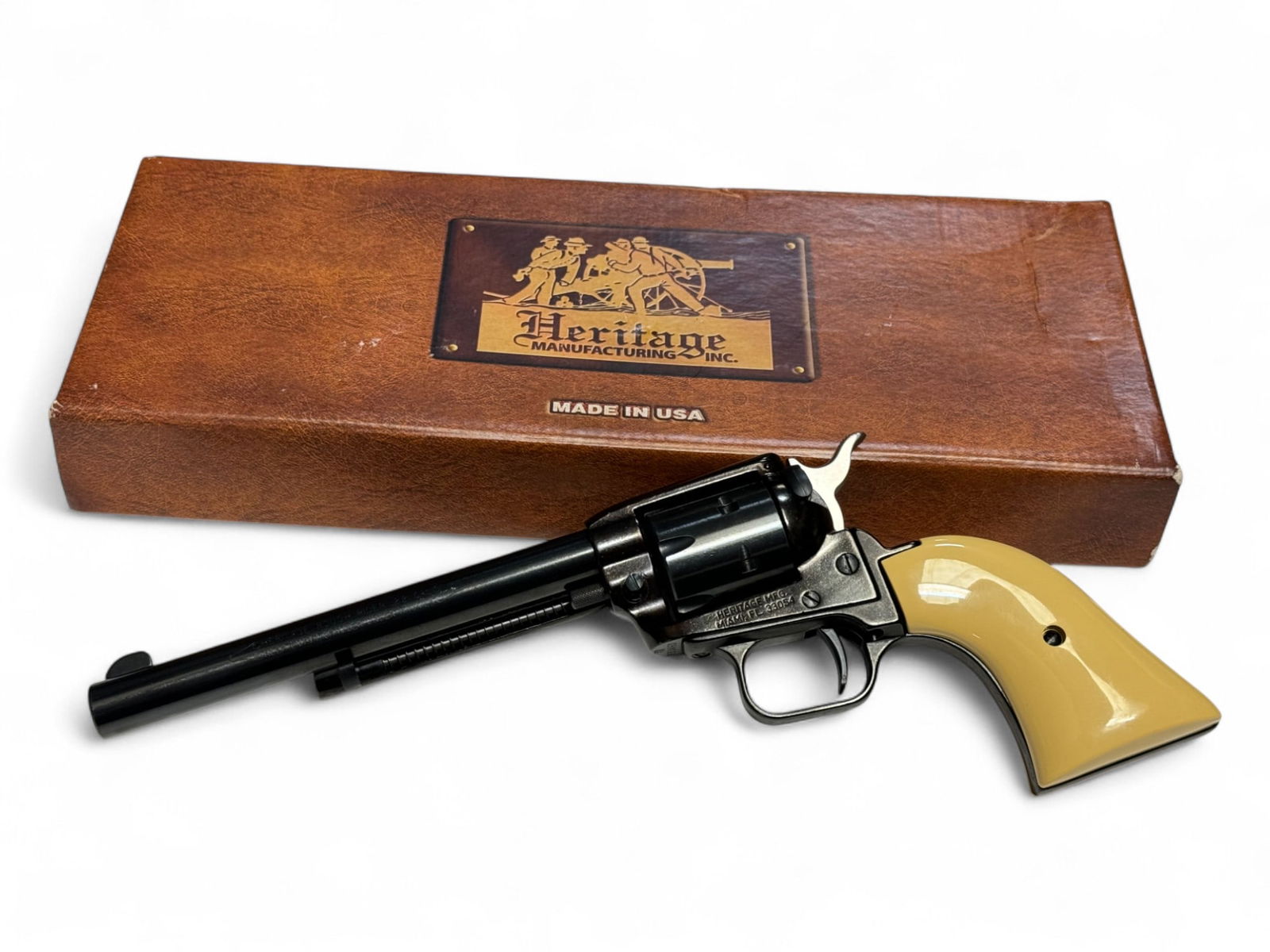 LNIB Heritage Rough Rider 6.5” Blue .22 LR Revolver in Box: S#: P33460 | Model RR22B6BR | 6.5” Barrel | 6-Shot, SA | Faux Aged Ivory Grips | Blue Finish | Comes in factory box with matching label, manual, and gun lock |||| CONDITION: Excellent, like new.