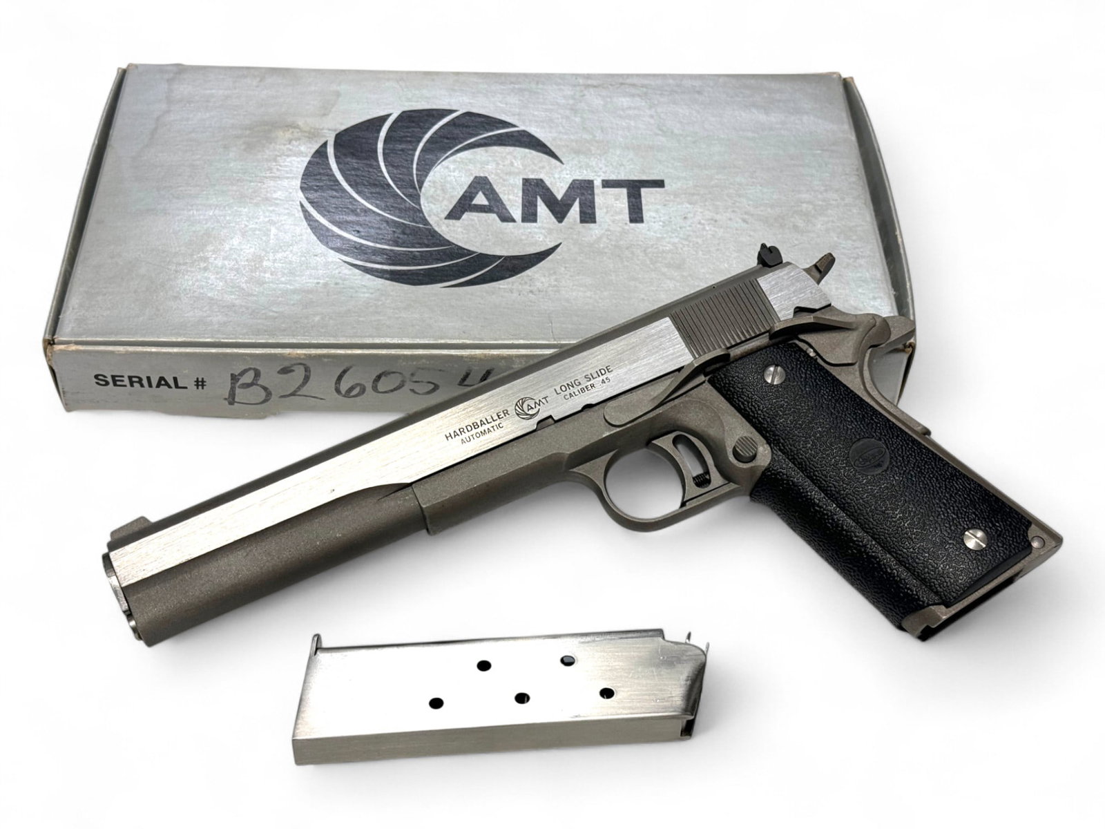 NIB Rare AMT 1911 Hardballer LONGSLIDE Model .45 ACP Semi-Automatic Stainless Pistol: S#: B26054 | Mfg. 1980s | This Longslide model is a specific model of the Hardballer series known for its extended slide and 5.5” Barrel. It’s also known as the Longballer or the “Te