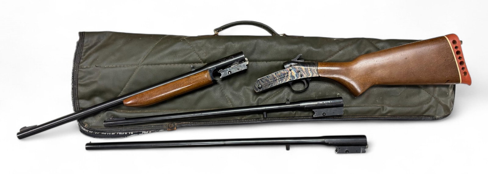 Excellent Rare H&R Topper Model 158 357 MAX Combination Handi-Rifle 3-Barrel Set in Case: S#: AG201326 | Mfg. 1962-1973 | Original hard rubber recoil pad | (1) .30-30 22” Barrel, (1) 20 GA. mod choke 3” chamber 26” Barrel, (1) .357 MAX 22” Barrel | Includes forend |