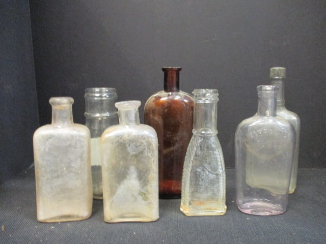 Seven Old Glass Flasks, Jeris Hair Tonic Bottle and Jumbo Brand Pepper Sauce Bottle: Pepper sauce bottle bottom has hole