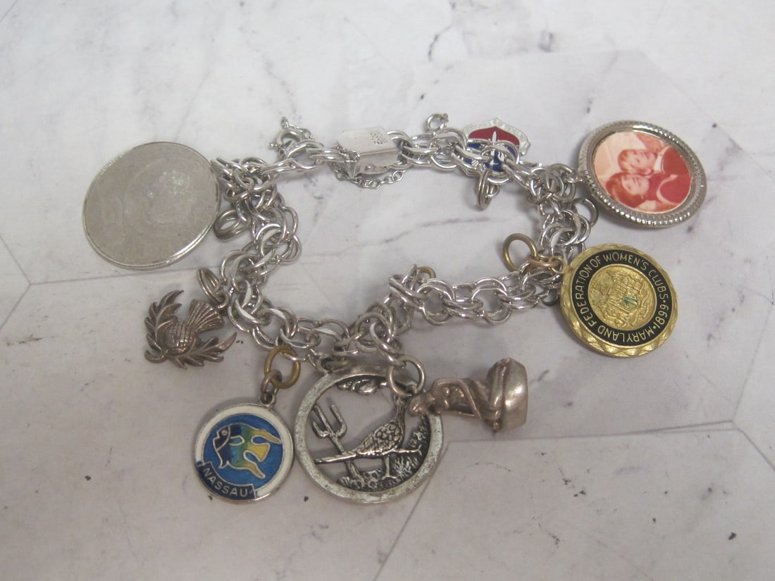 Vintage Sterling Silver Charm Bracelet with charms- Some charms are Sterling: Weighs 36 grams