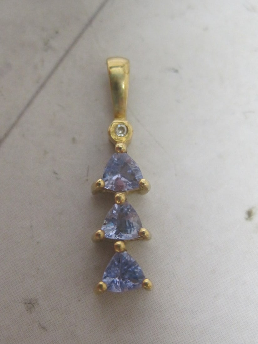 10k Gold Tanzanite and Diamond Pendant: Weighs .7 grams