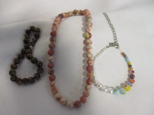 1 multigem bracelet, 1 tiger's eye Stretch bracelet, and (1 of 8)