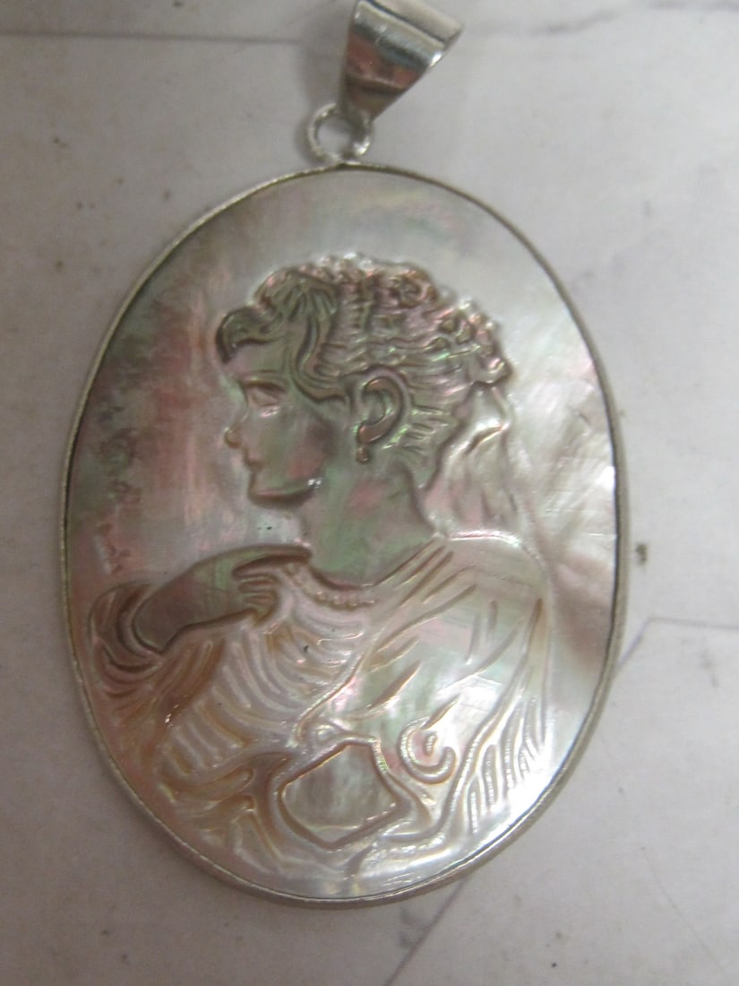 Sterling Silver Carved Abalone Cameo Pendant: .