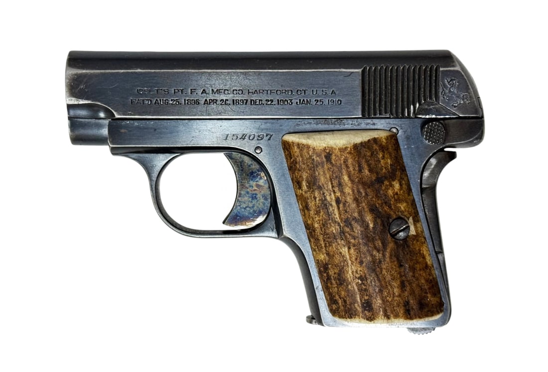 Excellent 1917 Colt Model 1908 Hammerless .25 ACP Semi-Automatic Vest Pocket Pistol w/ Stag Grips: S#: 154097 | Matching serial inside slide | Mfg. 1917 | Fitted with Genuine Stag Grips | Comes with (1) Correct two-tone magazine in excellent condition | Original Colt blue finish with beautiful case