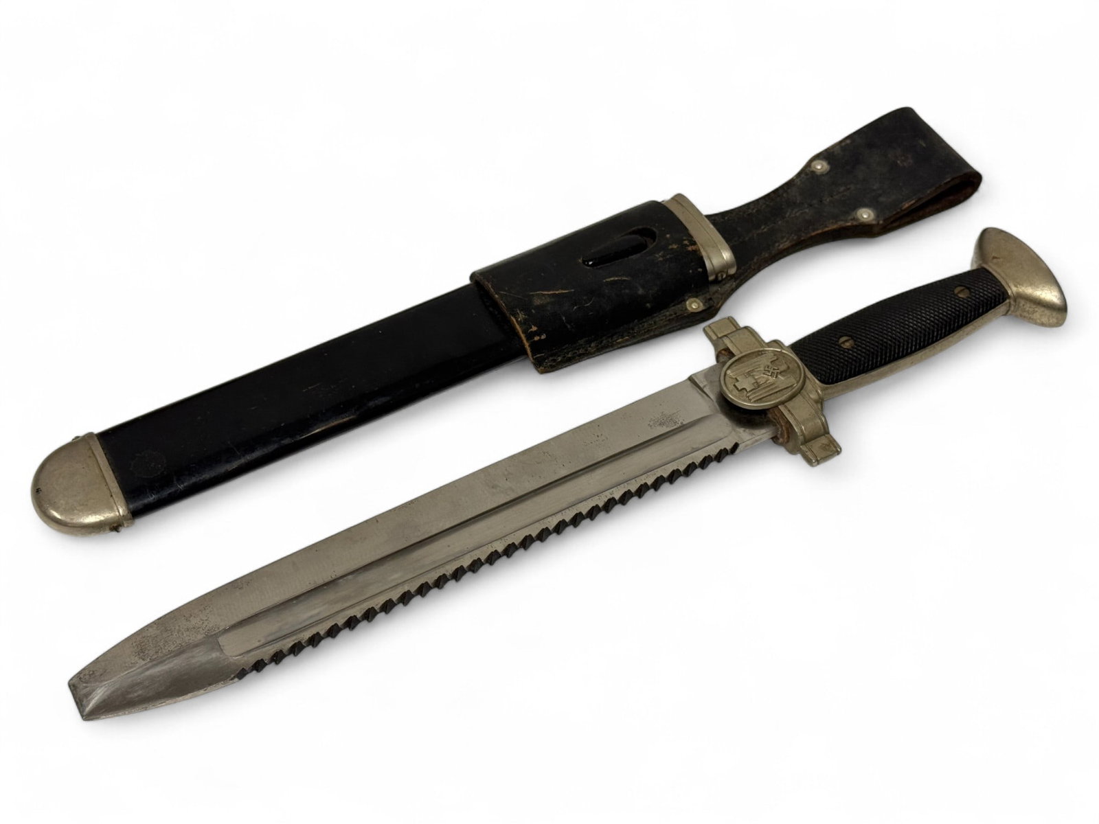 Excellent German WWII DRK Red Cross Hewer with Scabbard & Frog for Enlisted: Blade is stamped “Ges. Geschützt”. Overall this Hewer and scabbard are in excellent condition. The saw blade edges are sharp, and the blade surface is bright and excellent showing ver