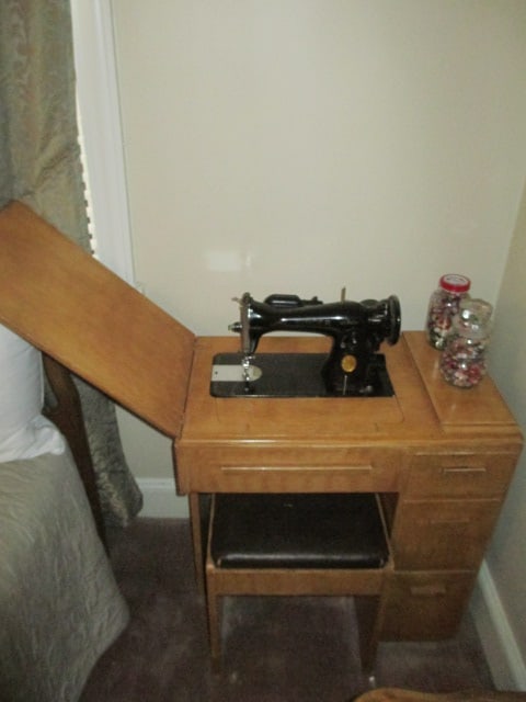 Vintage Singer AH396550 Sewing Machine in Wood Cabinet with Storage Bench: Untested but needle will turn freely with hand crank, Cabinet 29" x 17" x 38, approx. 64"w with top open, drawers and stool have sewing sundries and includes two jars of old buttons, Local Pickup Only