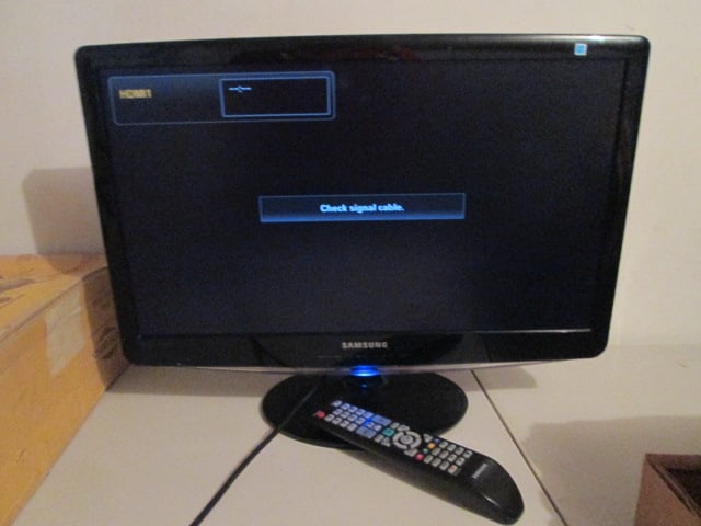 Samsung 23" Flat Screen TV with Remote: Model B2330HD, powers on, remote battery compartment has some corrosion, Local Pickup Only