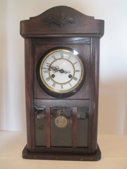 Vintage Mahogany Shelf Clock: 10 1/4" x 6" x 19", has key and pendulum, left stem will wind and right stem is wound tight, will chime but hand and time position needs adjusting