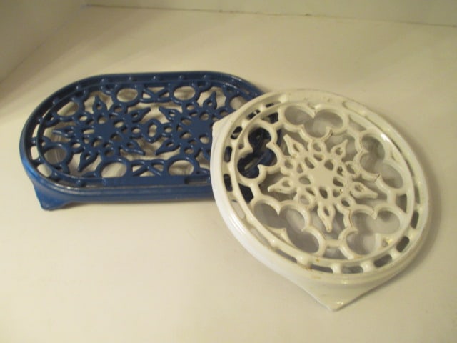 Le Creuset Round White Trivet and Blue Oval Trivet: White has a few cracks, Round 8 1/2"dia, Blue 11" x 7" oval 