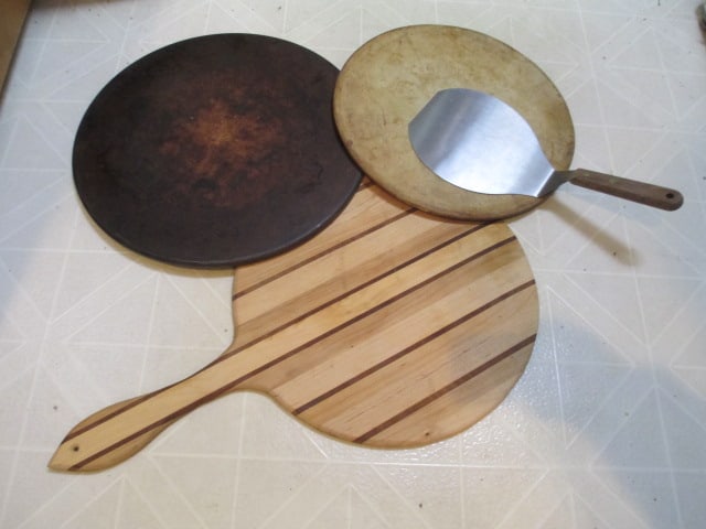 Hand Crafted Wooden Pizza Paddle, Two Stoneware Pizza Stones and Pizza Server: One pizza stone is The Pampered Chef, Local Pickup Only