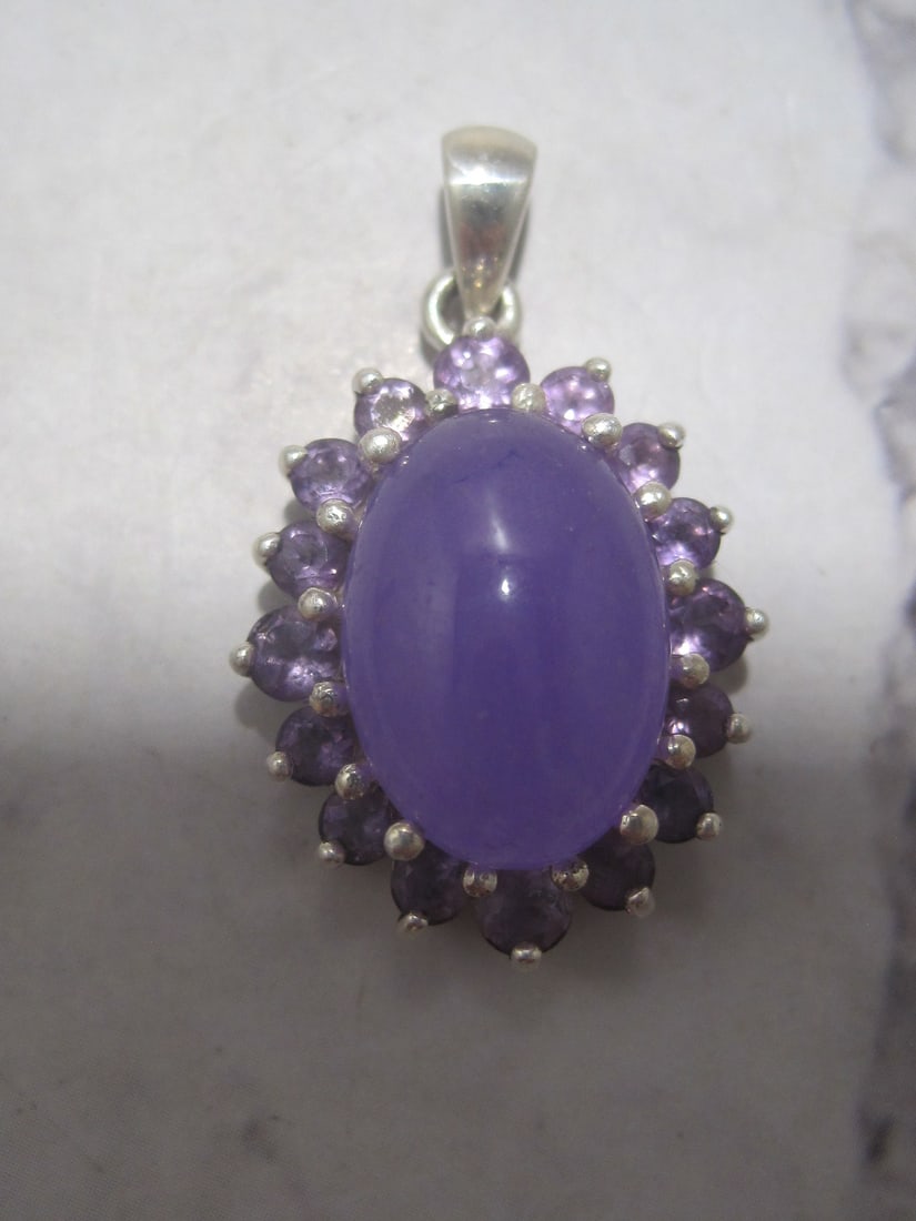 Sterling Silver Lavendar Jade & Amethyst Pendant: Weighs 4.5 grams, Oval stone surrounded by 16 round amethysts 