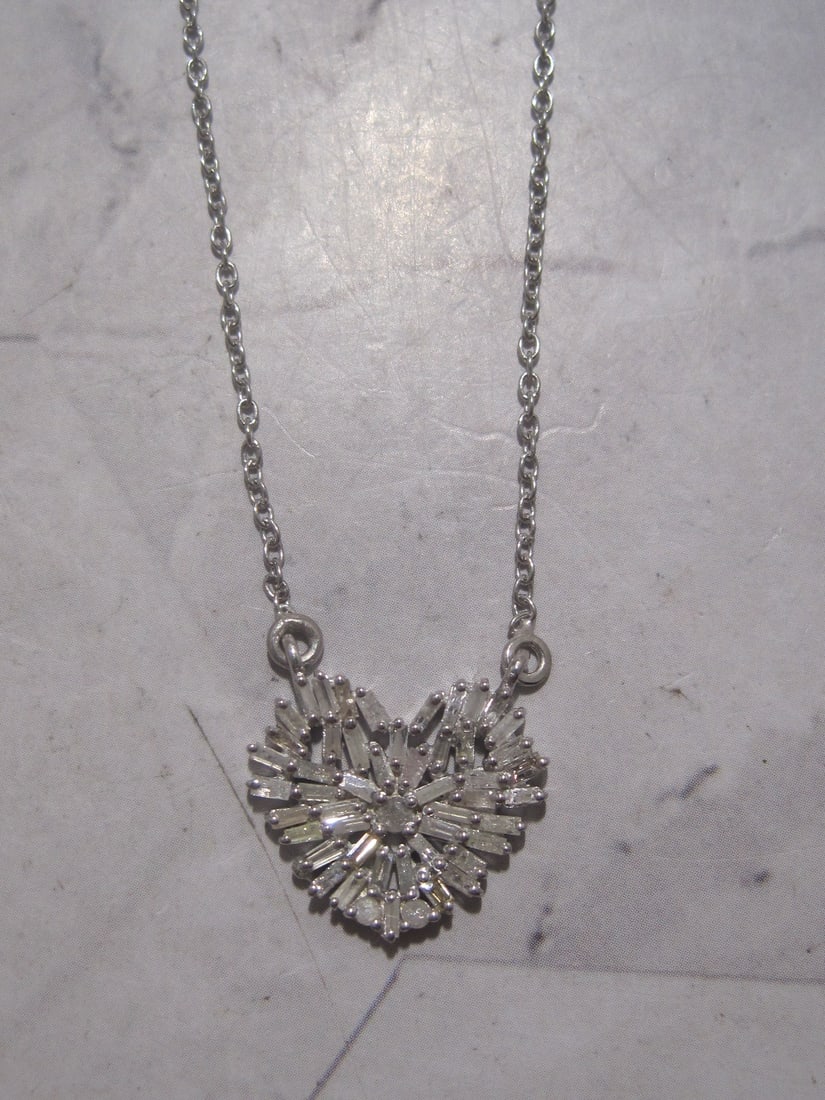 Sterling Silver Diamond Heart Pendant & Chain: Weighs 4 grams, Adjustable 16" to 18" chain, Baguette & round diamonds totaling 0.55 carat, New was $299.99 