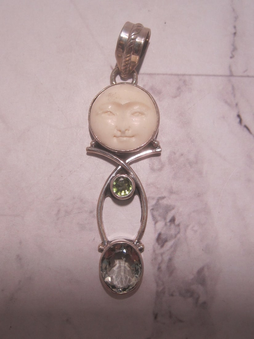 Sterling Silver Peridot & Blue Quartz Pendant: Weighs 8 grams, carved round face above
