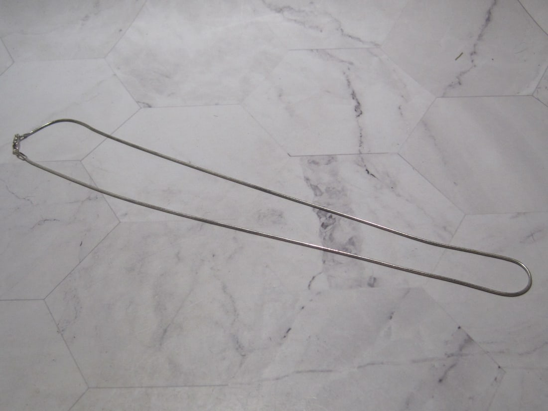 Sterling Silver "Snake Link" Chain: Weighs 5 grams, 18" long, rounded snake link 