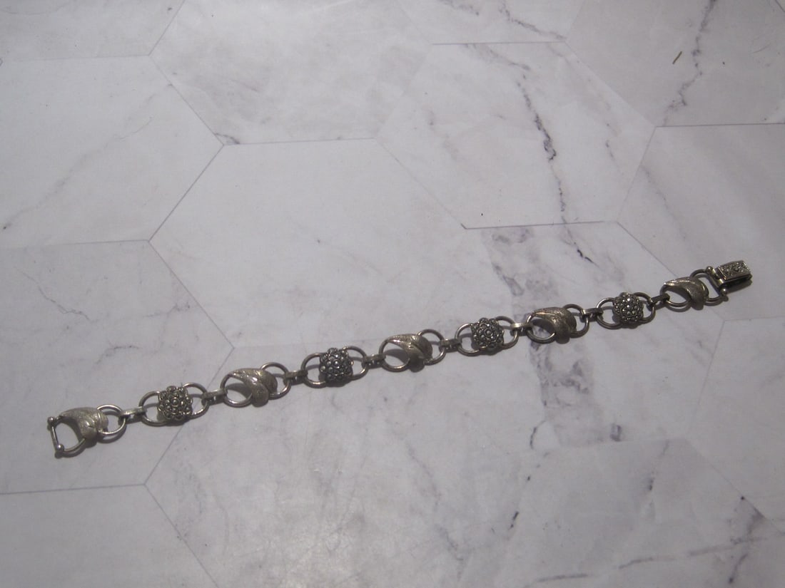 Sterling Silver Vintage Bracelet: Weighs 12 grams, 7" long, Marcasite floral design