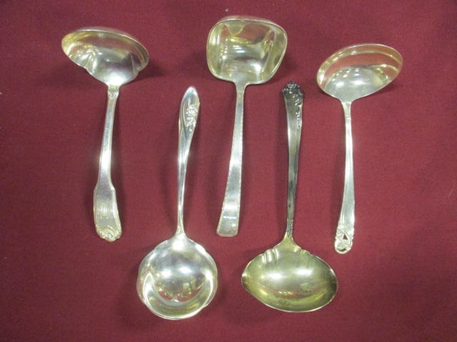 Five Sterling Sauce Ladles: 9.69 troy ounces total, two are monogrammed 