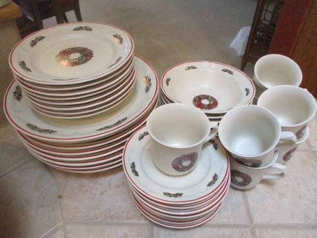 38 Pieces of Newcor Holiday Stoneware: (8)10 3/4"dia plates, (8)7 3/4"dia plates, (7)7"dia bowls, (8)Saucers, (7)3 1/4"h mugs 