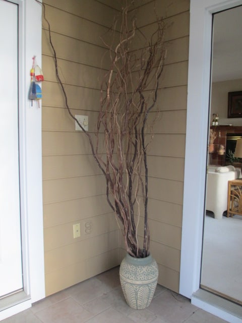 Bird and Flower in Relief Design Clay Vessel with Twig Arrangement (1 of 6)