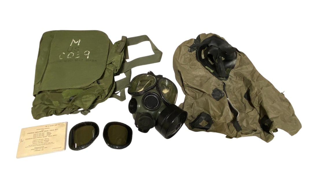 US Chemical Biological Field M40 Gas Mask in Bag with Manual: Manual is dated 1994. Comes with Face Mask / Hood Shield. Gas Mask has Extra Set of Lens. Manual included. Gas mask and Hood overall in Good Condition, may just need cleaning.