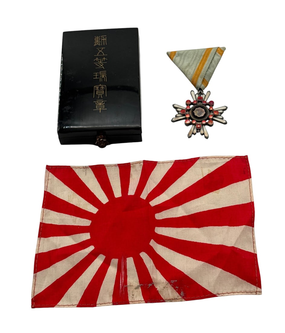 Japanese Cased Order of the Sacred Treasure & Small Uniform Size Silk Rising Sun: Antique 4 bolt reverse construction. Believed to be 5th or 6th Class - 1888-1945. The small flag is of silk construction and an original bringback piece. See photos.