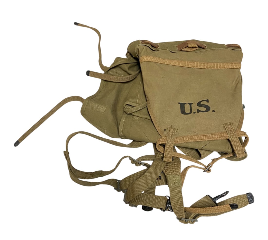 WWI Backpack Reissued for WWII: This backpack is stamped with multiple manufacturers and dates including Perkins Campbell 9-18. Also included is a Perkins 1918 inspector stamp. There is also a 1942 stamp. Excellent condition bag wit