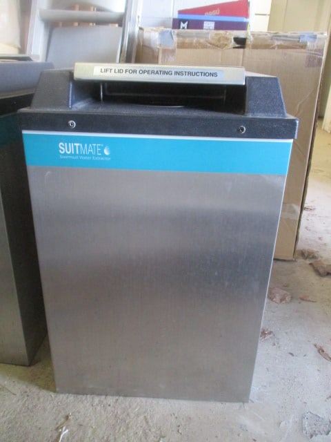 Suitmate Swimsuit Water Extractor: Serial # 74723, DOM 11/2016, has wall mount bracket, powers on and works, 15" x 14 3/4" x 23 3/4", Pickup Only 