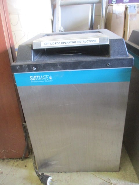 Suitmate Swimsuit Water Extractor: Serial # 67341, DOM 05/2010, has wall mount bracket, powers on and works, 15" x 14 3/4" x 23 3/4", Local Pickup Only 