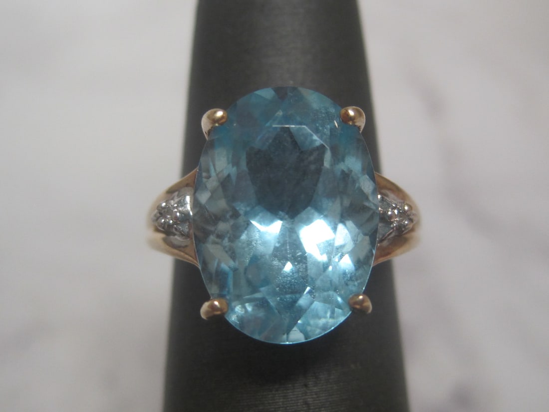 10k Gold Blue Topaz Ring with Diamond on each side (1 of 4)
