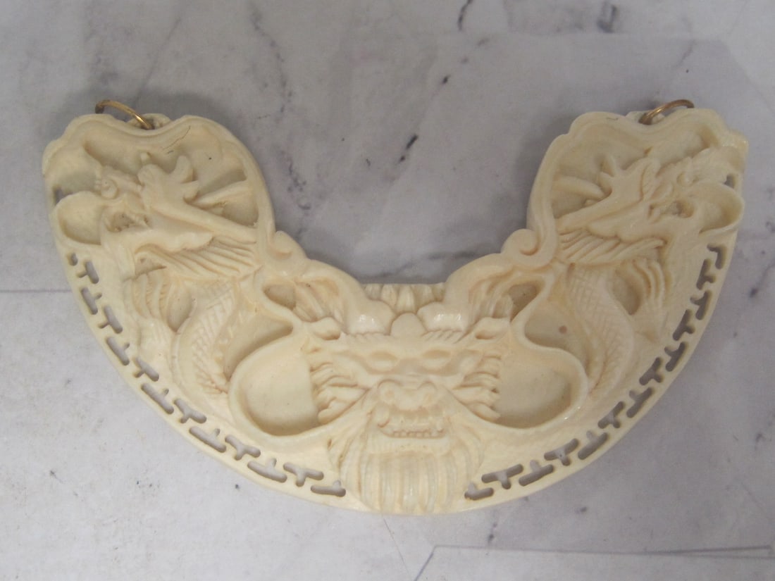 Intricately Carved Dragon Curved Pendant: . 