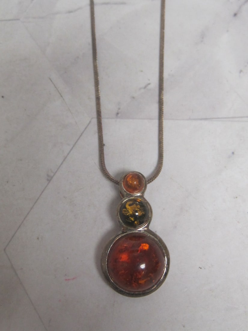 Sterling Silver Baltic Amber Pendant on 18" Sterling Silver Chain: Weighs 11.1 grams 