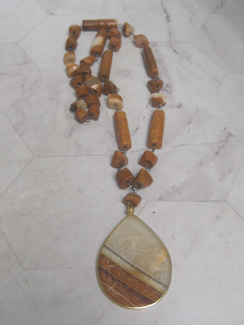 Carved Stone Pendant on 22" Beaded Necklace: . 