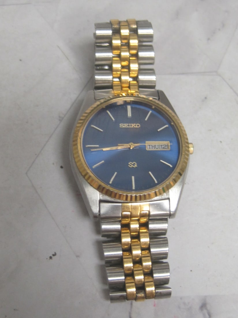 Seiko Man's Watch with Blue Face: Crystal has scratches 