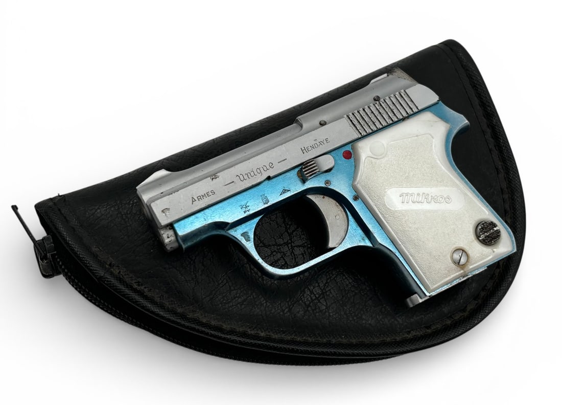 Micros Unique Hendaye .22 SHORT Semi-Automatic Pistol with Leather Gun Case: S#: 5599620 | Comes with (1) Magazine |||| CONDITION: Good. Pistol Retains 90% of the Blue on the Alloy Frame, and 95% of the Brushed Silver on the Slide. Bore is Excellent. Mechancially Functions.