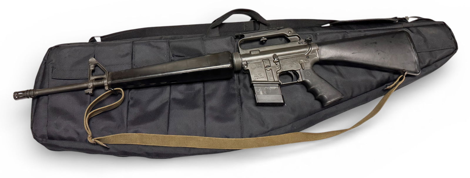 Early PREBAN Colt SP1 .223 REM. Semi-Automatic AR15 Rifle in Case: S#: SP21764 | Comes with the correct 20" CMP-marked pencil barrel, triangular hand guard and the correct full stock with storage | Equipped with a Hogue ergonomic rubber grip and a green canvas sling