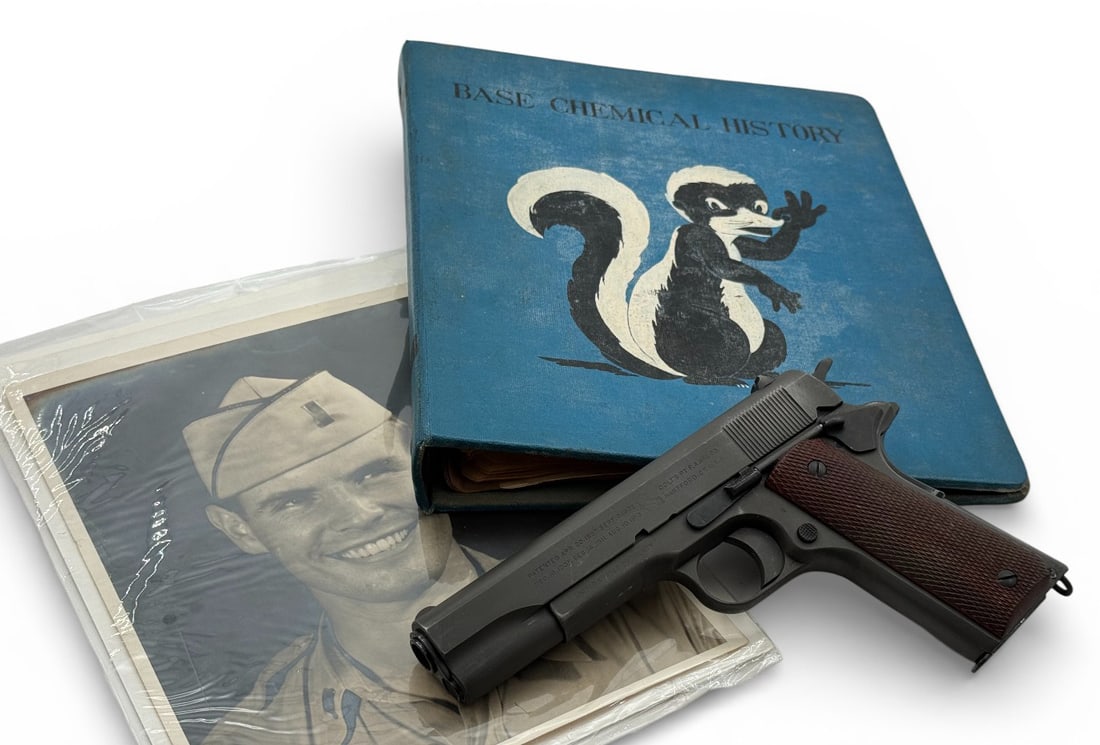 Excellent WWI/WWII 1918 Black Army Colt 1911 .45 ACP Semi-Automatic Pistol with Album: S#: 505072 | Pistol was manufactured sometime in 1918-1919 for WWI. Looks like it went through some reconditioning for WWII. Now features a parkerized finish, but still retains what looks like WWI