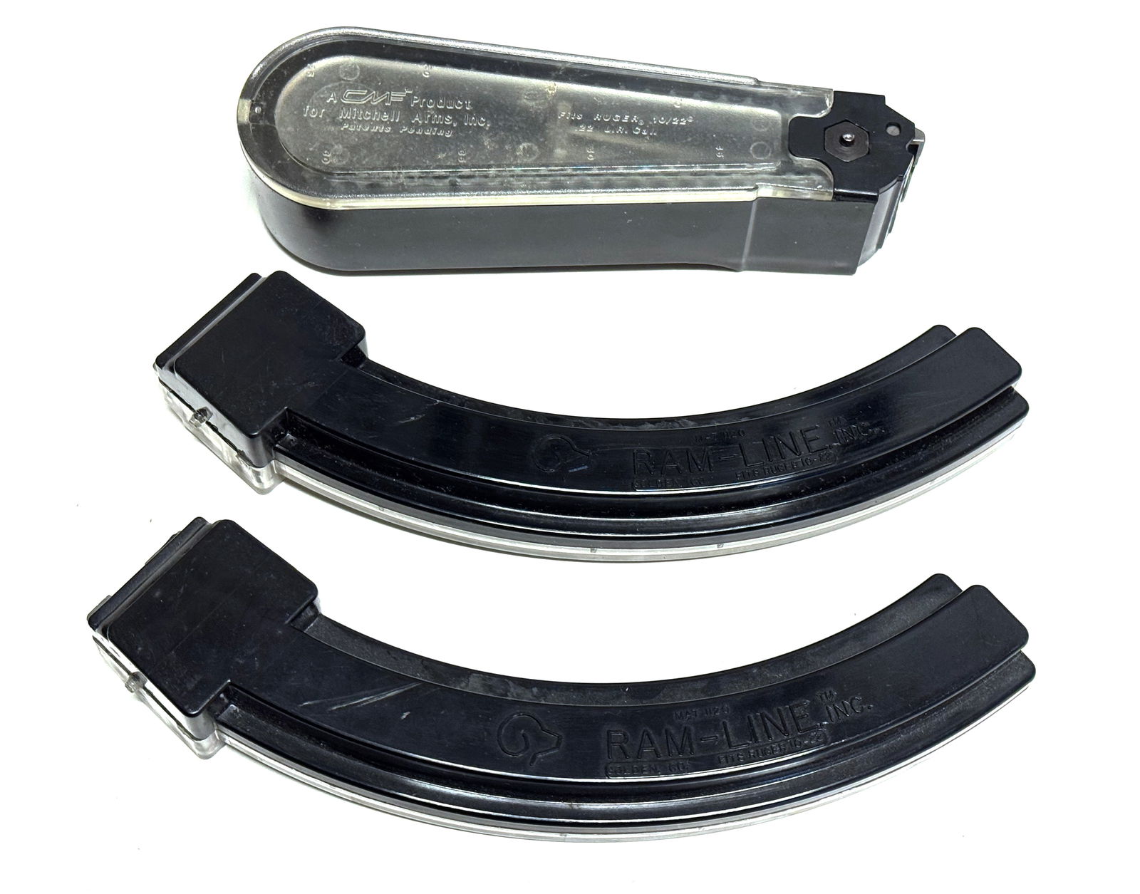 Mitchell Arms Teardrop Magazine and (2) 25-Rd Ram-Line Mags for Ruger 10/22: This lot contains one Hard-to-find mitchell arms teardrop magazine and (2) Ram-Line 25-Round Banana Mags for the Ruger 10/22 Carbine. 