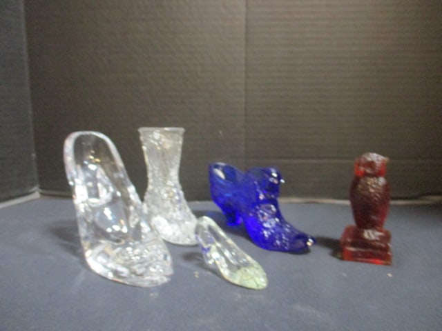 Fenton Cobalt Blue Shoe with Panther Head, Degenhart Hallmarked Amberina Owl on Stacked: Books and Three Clear Glass Shoes. Fenton shoe has Fenton logo and Silver Foil Sticker 
