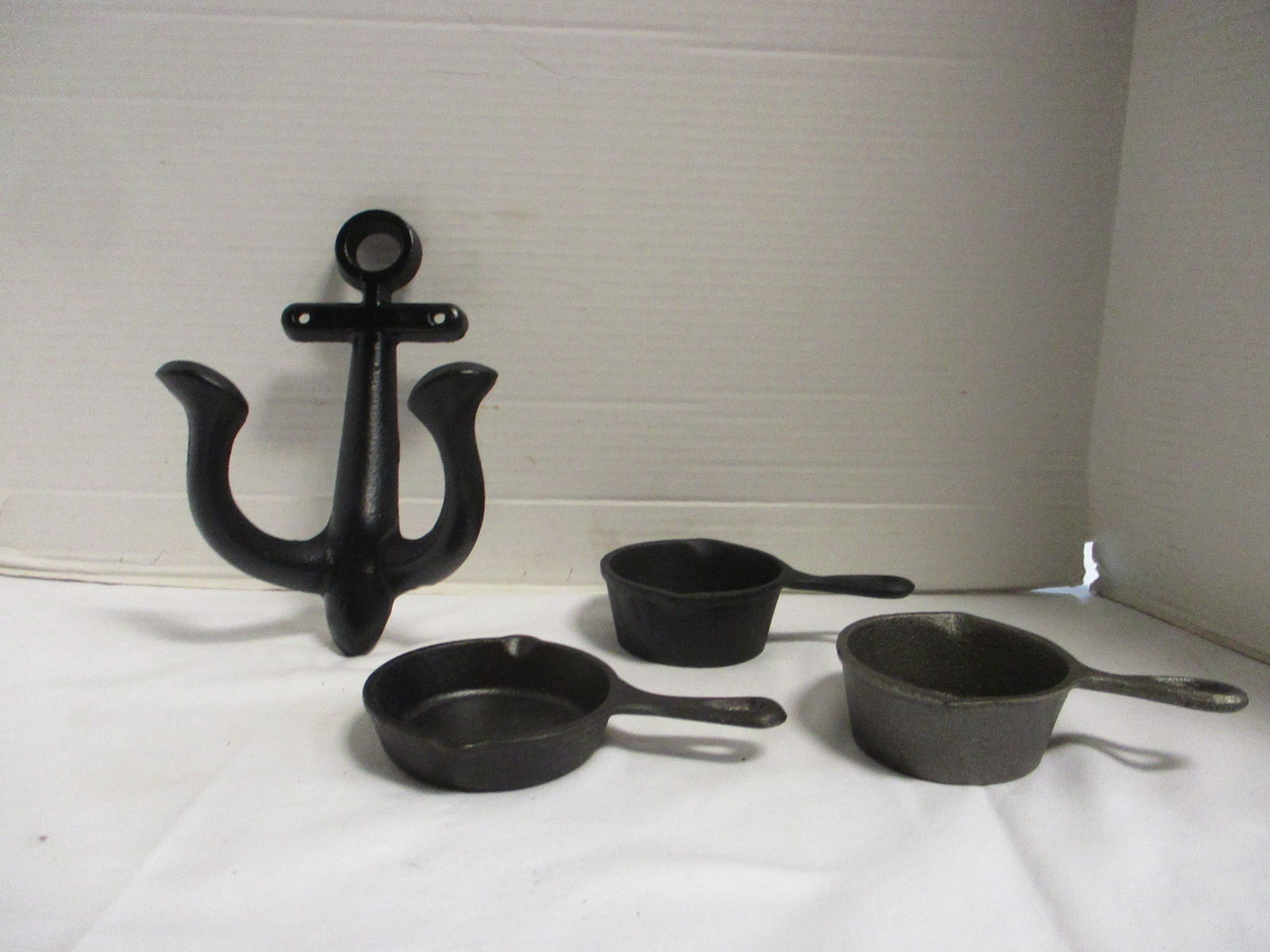 Cast Iron Anchor Coat Hook and Three Cast Iron Ashtrays-One Lodge (1 of 11)