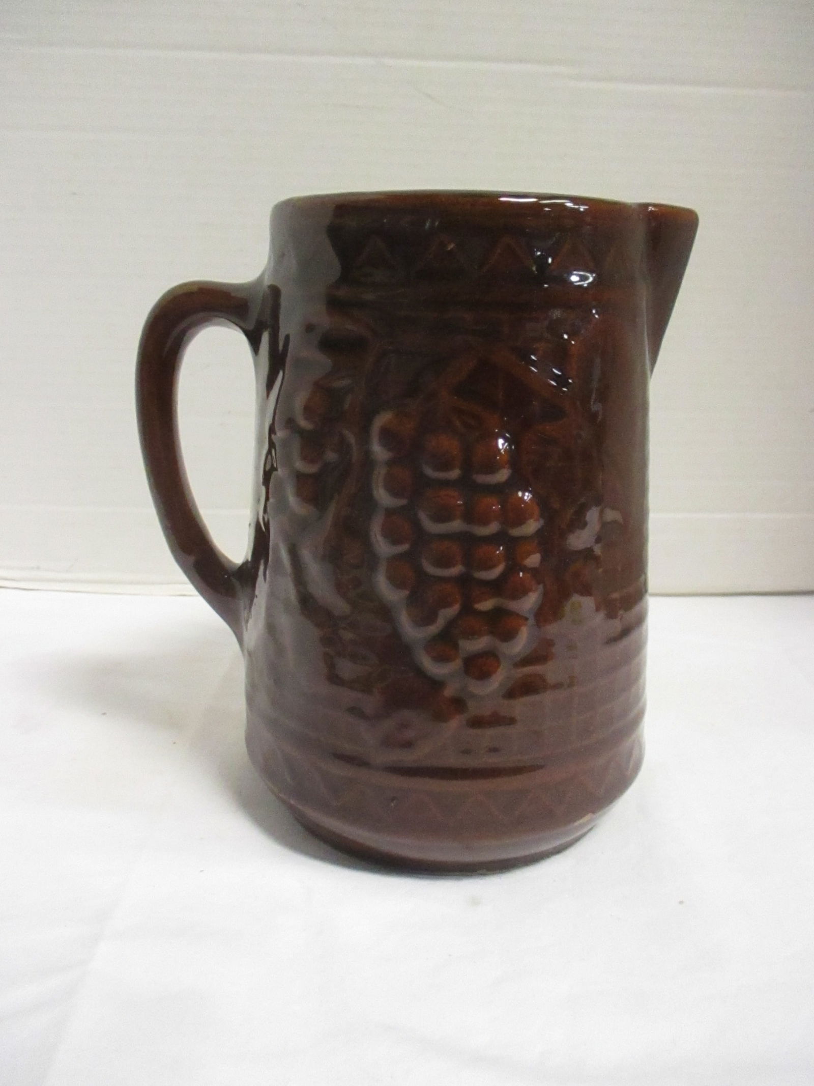Circa 1910-20 Grape and Cable Design Stoneware Pitcher: 8"h, date per consigner note 