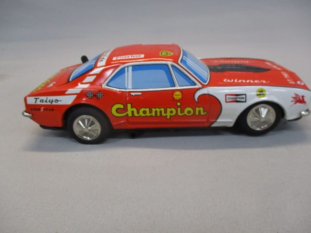 1970's/80's Champion Non-Fall Mystery Bump-N-Go Tin Toy - 7