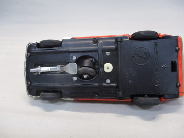 1970's/80's Champion Non-Fall Mystery Bump-N-Go Tin Toy - 7